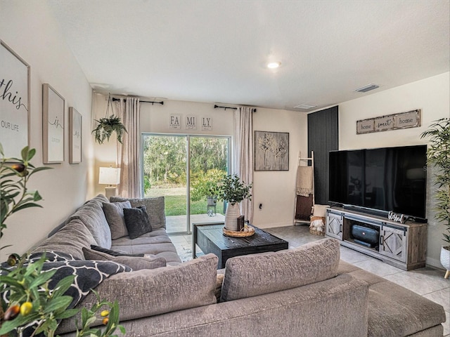 17012 Oval Rum Dr, Wimauma, FL 33598 - living room featuring tile patterned floors and baseboards