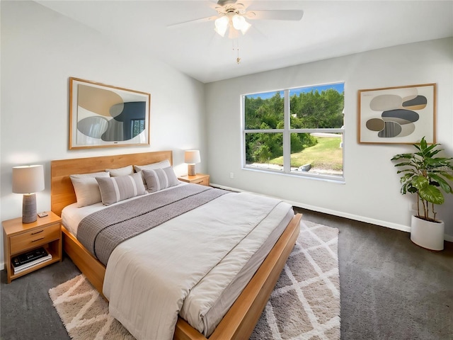 carpeted bedroom with baseboards and ceiling fan