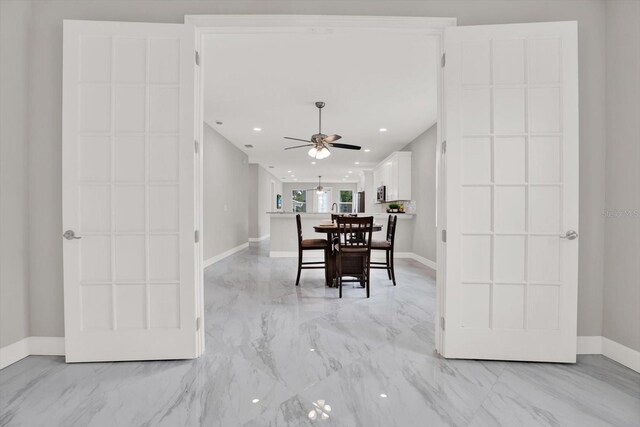 4071 45th Ave N, Saint Petersburg, FL 33714 - dining area with light marble finish flooring, a ceiling fan, baseboards, and recessed lighting