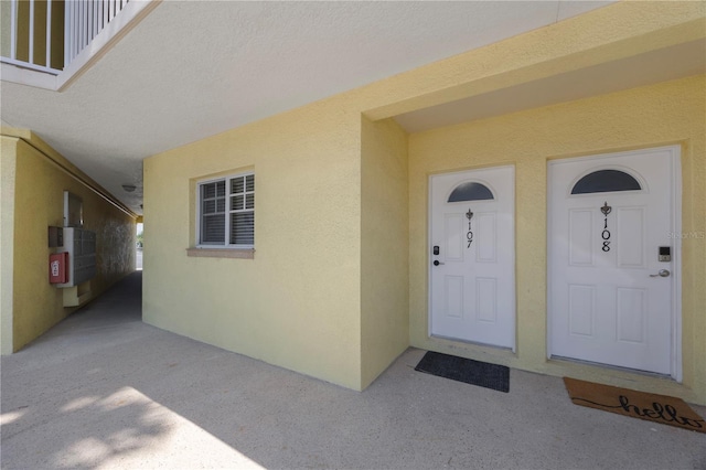 4103 Gulf Blvd Unit 107, St Pete Beach, FL 33706 - property entrance featuring stucco siding