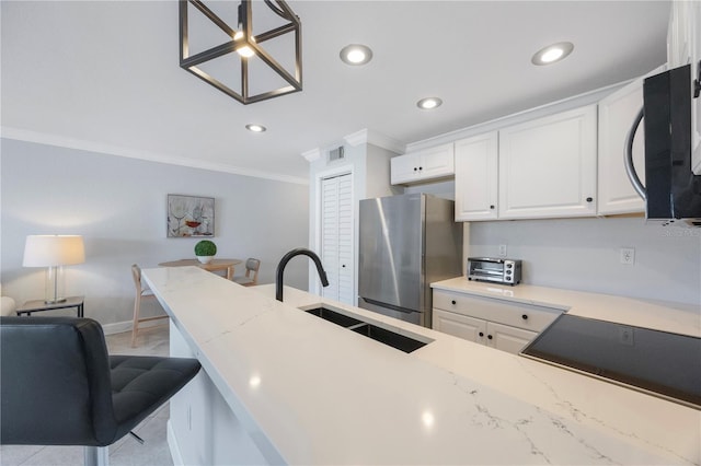4103 Gulf Blvd Unit 107, St Pete Beach, FL 33706 - kitchen featuring freestanding refrigerator, black microwave, a sink, crown molding, and white cabinets