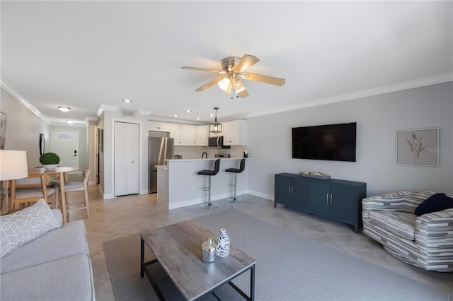 4103 Gulf Blvd Unit 107, St Pete Beach, FL 33706 - living area with crown molding, light tile patterned floors, a ceiling fan, baseboards, and recessed lighting