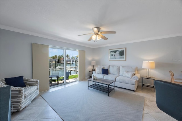 4103 Gulf Blvd Unit 107, St Pete Beach, FL 33706 - living area featuring a ceiling fan, ornamental molding, and light tile patterned flooring