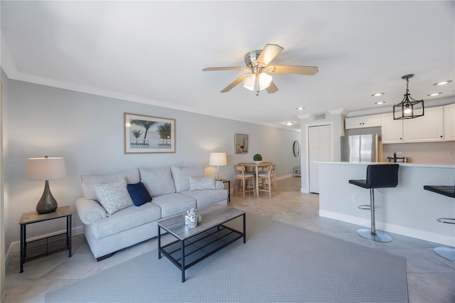 4103 Gulf Blvd Unit 107, St Pete Beach, FL 33706 - living room with ornamental molding, baseboards, ceiling fan, light tile patterned floors, and recessed lighting