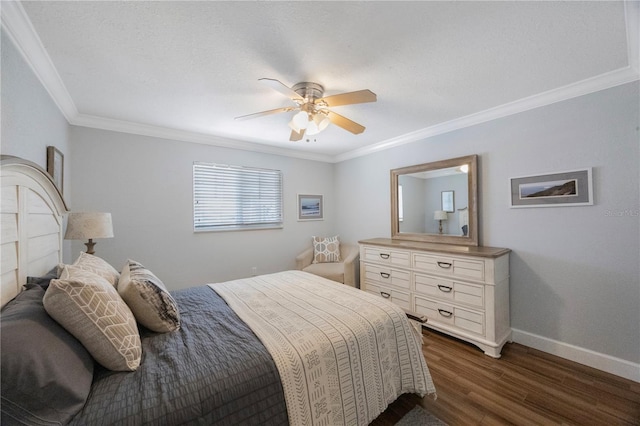 4103 Gulf Blvd Unit 107, St Pete Beach, FL 33706 - bedroom with crown molding, dark wood-style floors, baseboards, and ceiling fan