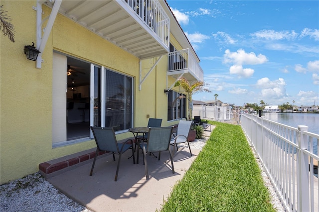 4103 Gulf Blvd Unit 107, St Pete Beach, FL 33706 - view of patio featuring a water view