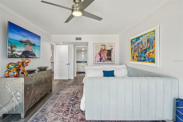 7564 Bayshore Dr Unit 302, Treasure Island, FL 33706 - bedroom featuring dark wood-type flooring, ornamental molding, radiator heating unit, and a ceiling fan