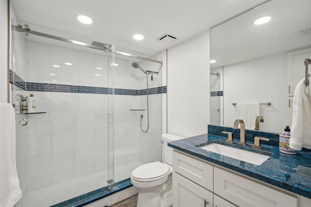 7564 Bayshore Dr Unit 302, Treasure Island, FL 33706 - bathroom featuring a stall shower, toilet, vanity, and recessed lighting