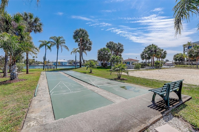 7564 Bayshore Dr Unit 302, Treasure Island, FL 33706 - view of property's community featuring shuffleboard, a yard, and a water view