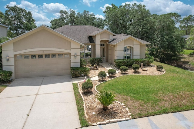 view of front of house with stucco siding, a front yard, a garage, driveway, and roof with shingles