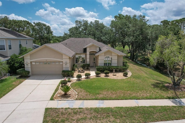 view of front of home with a garage, stucco siding, a front yard, driveway, and roof with shingles