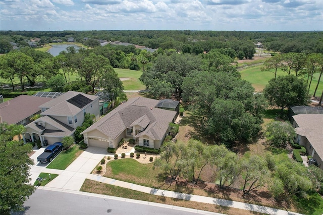 aerial view of residential area with a golf course and a large body of water