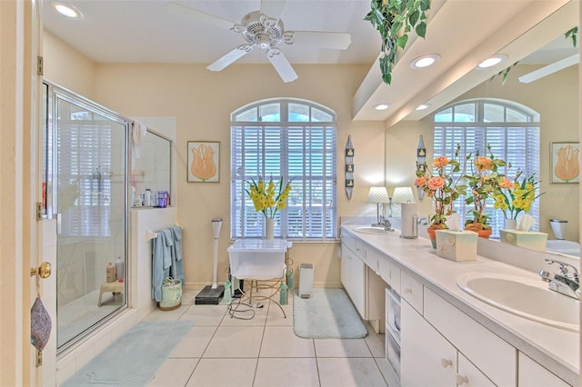 full bathroom with recessed lighting, tile patterned flooring, a shower stall, a ceiling fan, and healthy amount of natural light