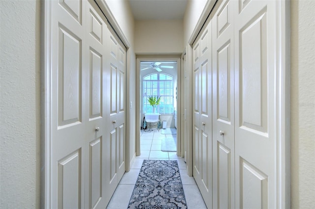 hall with light tile patterned flooring