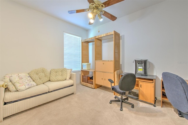 office area with light carpet and a ceiling fan
