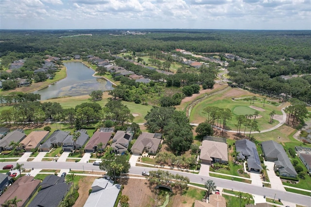 aerial overview of property's location with nearby suburban area, a heavily wooded area, and a nearby body of water