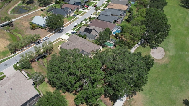 aerial view of property's location with nearby suburban area