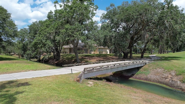 view of home's community featuring a lawn
