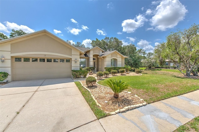 view of front of property featuring stucco siding, a front yard, an attached garage, and concrete driveway