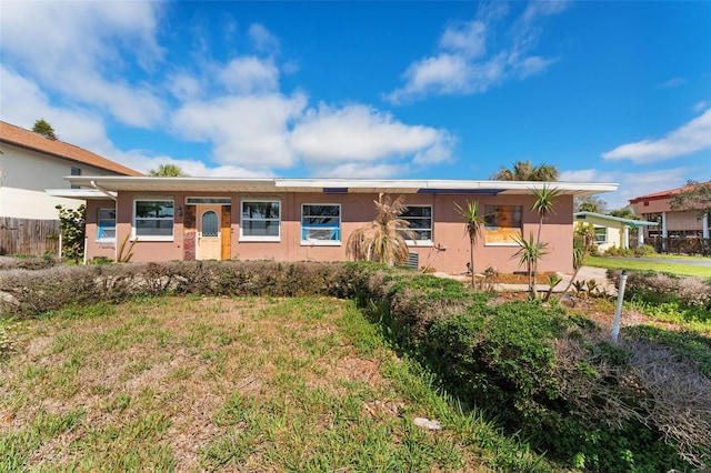 7075 Sunset Dr S, South Pasadena, FL 33707 - ranch-style house with stucco siding