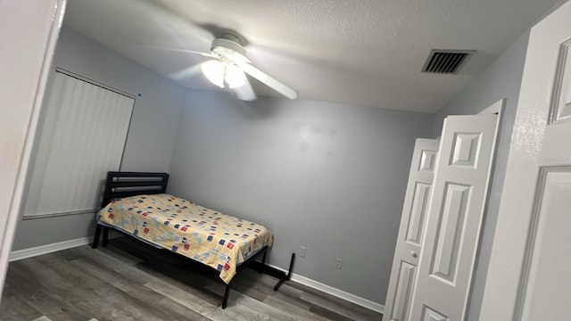 8423 Edgewater Place Blvd, Tampa, FL 33615 - bedroom with wood finished floors, a ceiling fan, and baseboards