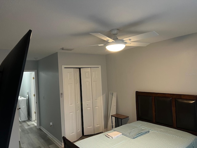 8423 Edgewater Place Blvd, Tampa, FL 33615 - bedroom featuring wood finished floors, a closet, a ceiling fan, and baseboards