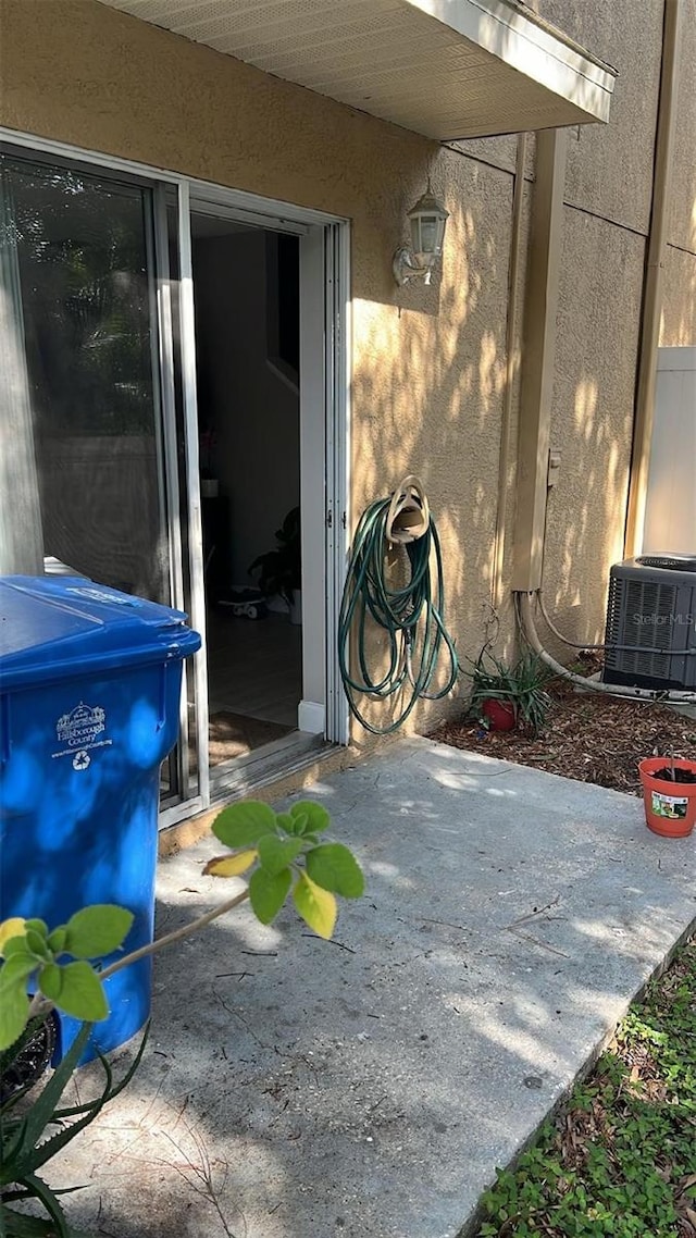 8423 Edgewater Place Blvd, Tampa, FL 33615 - view of patio / terrace featuring cooling unit
