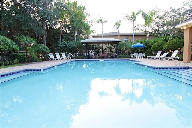 8423 Edgewater Place Blvd, Tampa, FL 33615 - community pool featuring a gazebo and a patio area