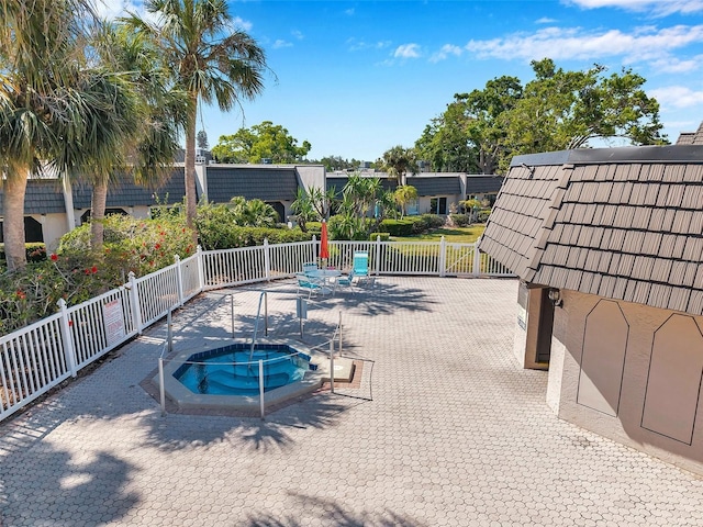 2003 Cordova Grn, Seminole, FL 33777 - view of pool with a hot tub, fence, and a patio