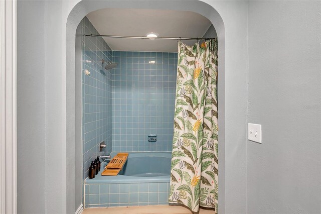 2003 Cordova Grn, Seminole, FL 33777 - bathroom featuring shower / tub combo with curtain and a textured wall