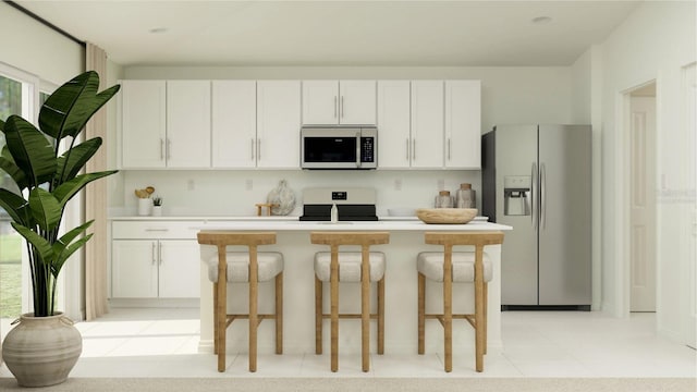 kitchen with stainless steel refrigerator with ice dispenser, stove, a center island, and white cabinetry