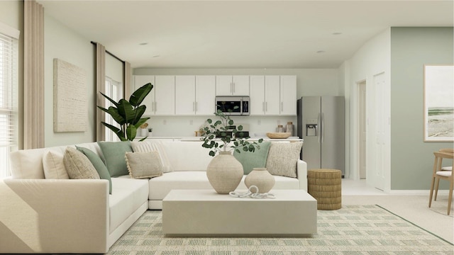 living area with light carpet and baseboards