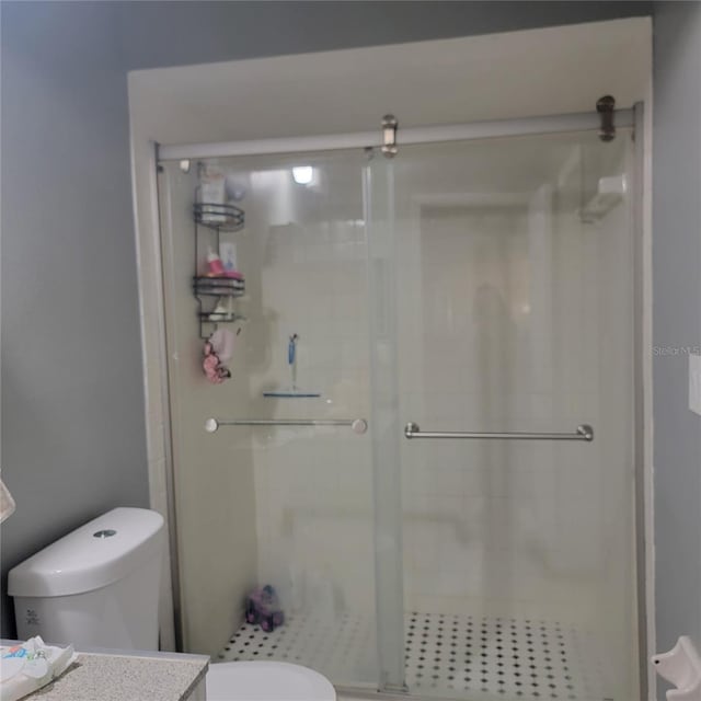 11511 113th St Unit 5C, Largo, FL 33778 - bathroom with toilet, a shower stall, and vanity