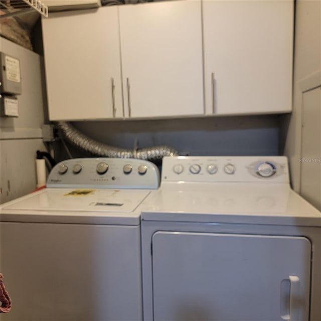 11511 113th St Unit 5C, Largo, FL 33778 - laundry room featuring cabinet space and washing machine and clothes dryer