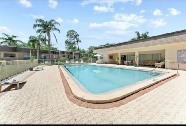 11511 113th St Unit 5C, Largo, FL 33778 - community pool featuring a patio
