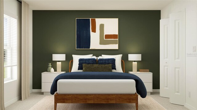 bedroom with carpet flooring, multiple windows, and baseboards