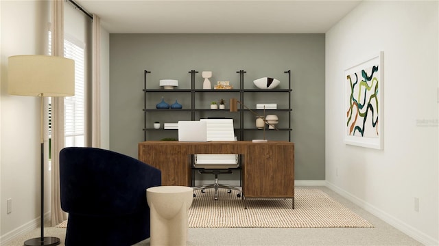 office area featuring baseboards and carpet flooring