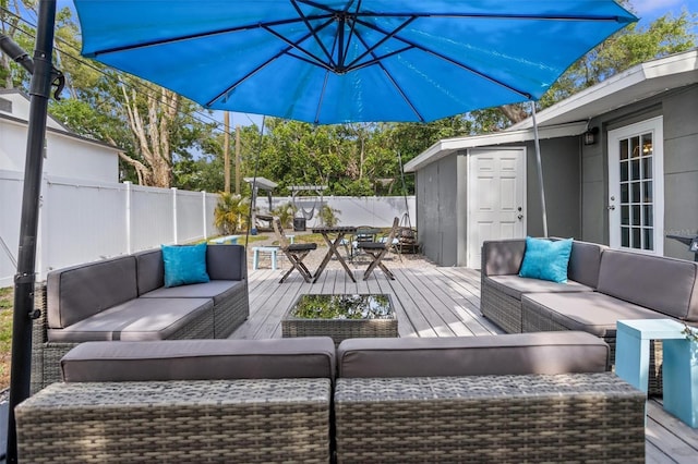 3245 Freemont Ter S, Saint Petersburg, FL 33712 - wooden deck with outdoor lounge area, a fenced backyard, and outdoor dining space