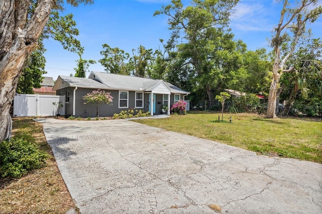3245 Freemont Ter S, Saint Petersburg, FL 33712 - ranch-style house with driveway and a gate