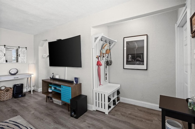 3245 Freemont Ter S, Saint Petersburg, FL 33712 - living room featuring wood finished floors, a textured ceiling, and baseboards