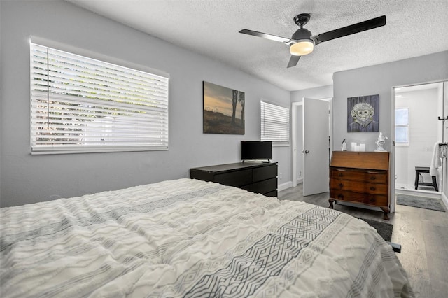3245 Freemont Ter S, Saint Petersburg, FL 33712 - bedroom featuring a textured ceiling, wood finished floors, baseboards, and ceiling fan