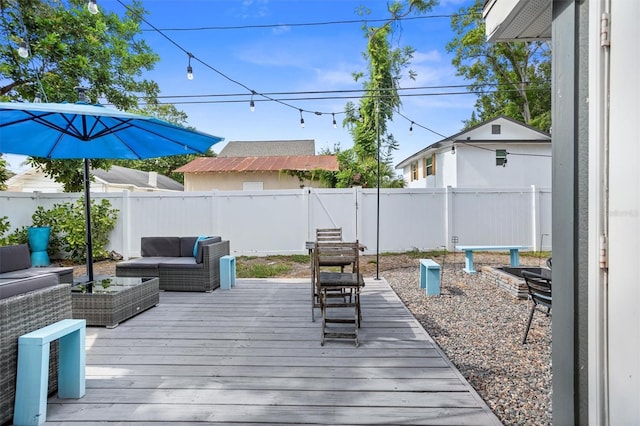 3245 Freemont Ter S, Saint Petersburg, FL 33712 - wooden terrace featuring an outdoor hangout area and a fenced backyard