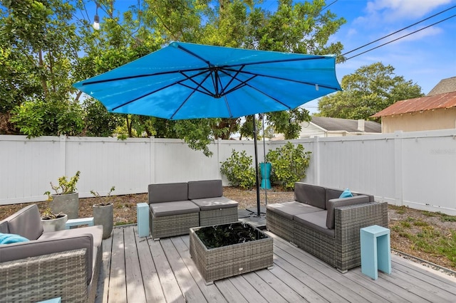 3245 Freemont Ter S, Saint Petersburg, FL 33712 - wooden deck with an outdoor hangout area and a fenced backyard