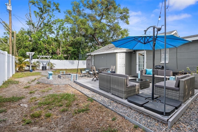 3245 Freemont Ter S, Saint Petersburg, FL 33712 - rear view of property with outdoor lounge area and a fenced backyard