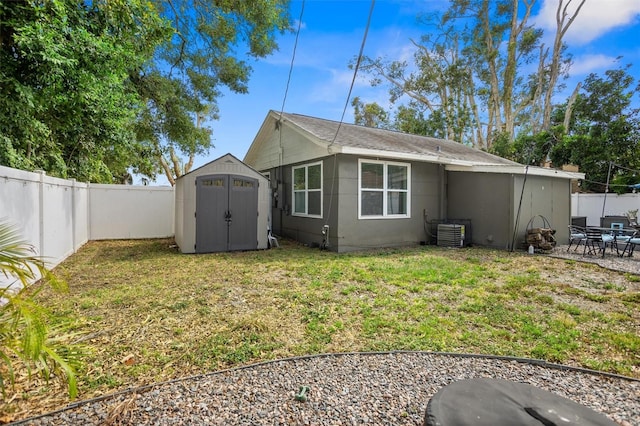 3245 Freemont Ter S, Saint Petersburg, FL 33712 - view of side of home featuring a storage shed, central AC, an outdoor structure, and a patio