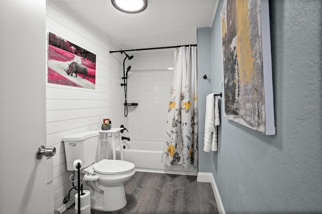 3245 Freemont Ter S, Saint Petersburg, FL 33712 - full bath with wood finished floors, toilet, shower / bathtub combination with curtain, and baseboards