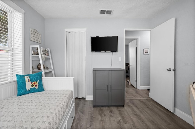3245 Freemont Ter S, Saint Petersburg, FL 33712 - bedroom featuring wood finished floors, a textured ceiling, and baseboards