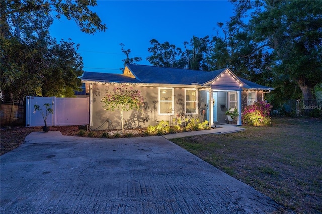 3245 Freemont Ter S, Saint Petersburg, FL 33712 - ranch-style home with stucco siding, driveway, and a gate