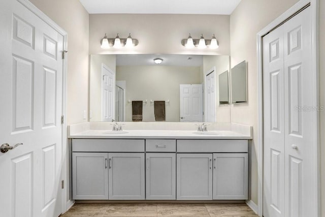 29901 Southwell Ln, Wesley Chapel, FL 33543 - bathroom featuring a closet and double vanity