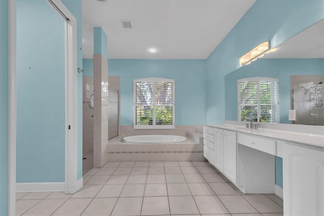 12002 Hope Ln, Tampa, FL 33618 - full bath featuring healthy amount of natural light, vanity, a bath, and tiled shower